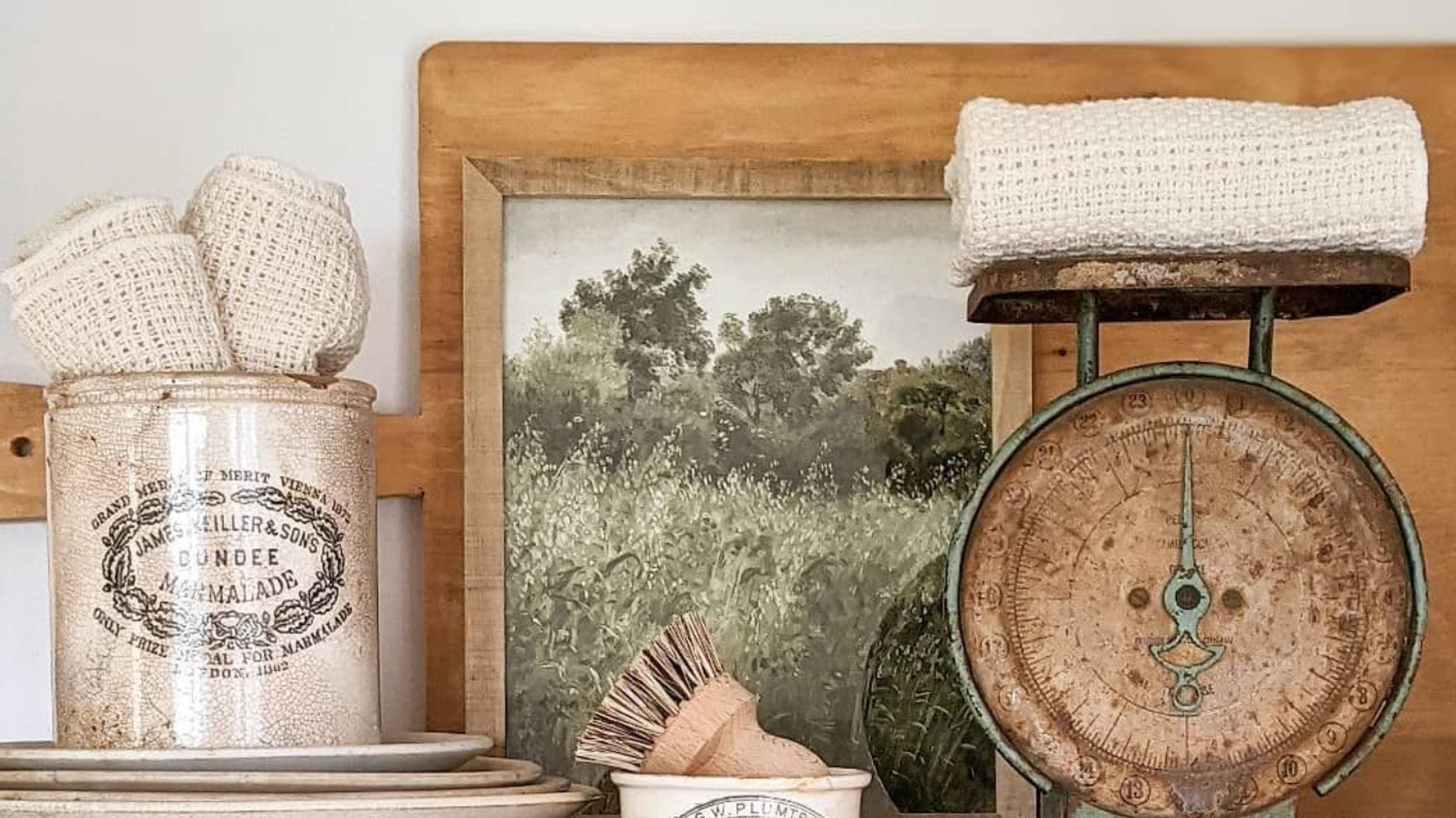 A collection of restored antiques arranged outside a country home